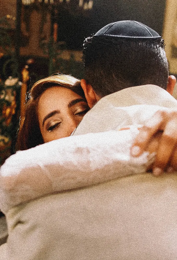 Bride and groom exchanging wedding vows at a Jewish wedding